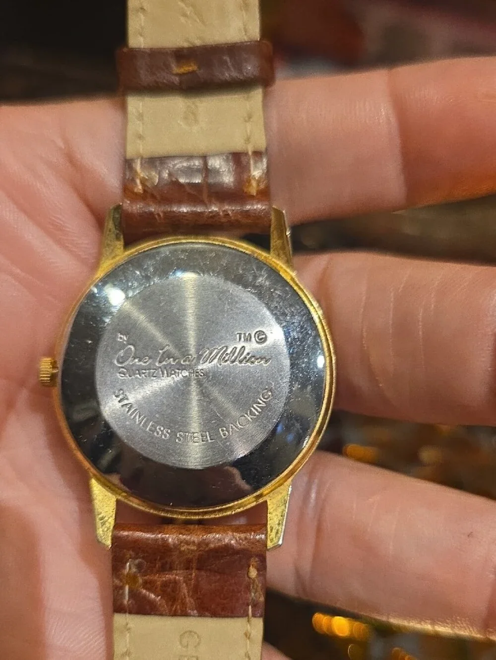 Vintage Gold-Tone Watch with Brown Leather Strap and Yellow Dial